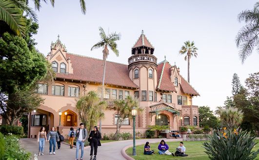 A shot of the Doheny mansion with students milling around.