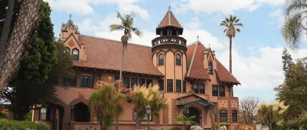 doheny mansion with palm trees