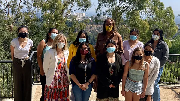 A large group photo outdoors.