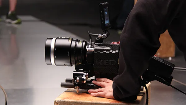 An image of a person using a RED video camera.