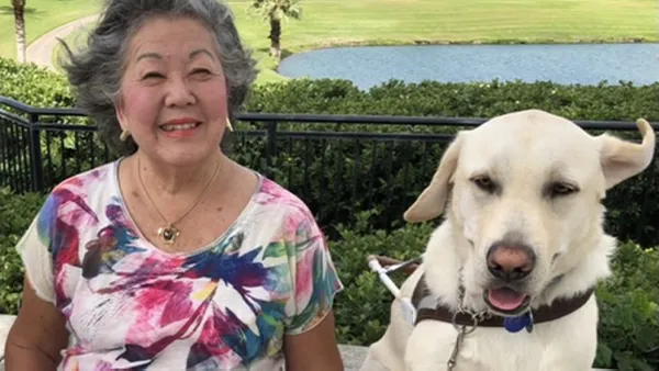 An portrait of a woman and her dog.