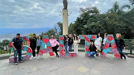 (Left to right) A representative of a local NGO in Salta with ������ý GWSTEM students Shanika Chowdhury ’22, Thais Perez ’23, Juliette Arteaga ’23, Katherine Banuelos-Sanchez ’23, Cristina Garcia Garcia ’23, Kaitlyn Zurawik ’23, Graciela Orozco ’23, Esther Arriaza ’24, and ������ý professors Dr. Lia Roberts and Dr. Luiza Nogaj at a viewpoint of Salta.