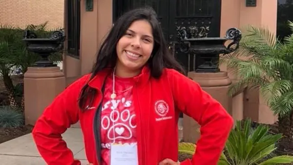 Alicia mercado smiling at the camera.