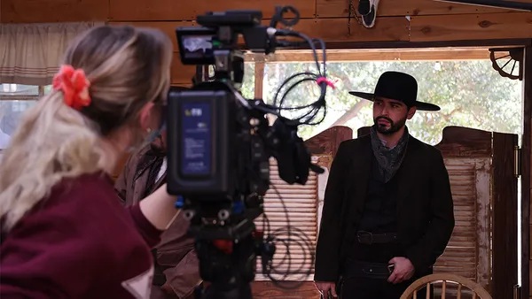 Students filming at a production workshop