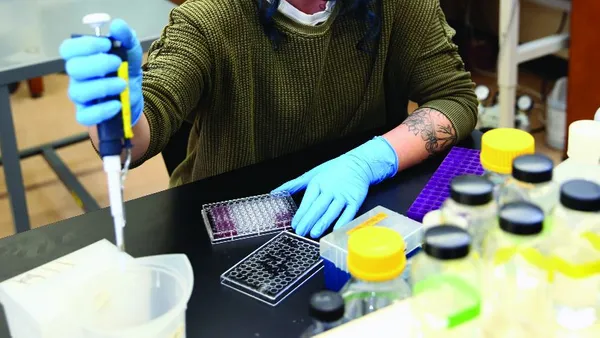 Women pipetting in a lab