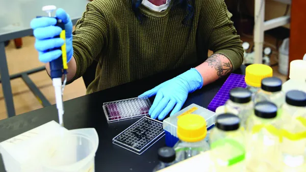 Women pipetting in a lab