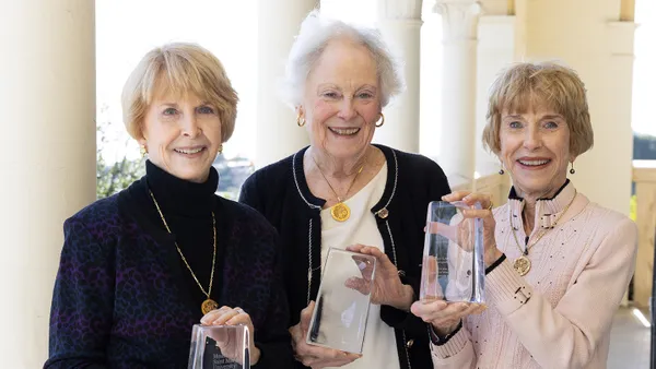 Peggy Leahy Starr, Sharon Leahy and Mickey Leahy Payne with their Unstoppable Supporter awards