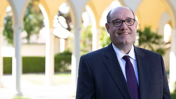 Tom Blumenthal smiling on the Chalon Campus