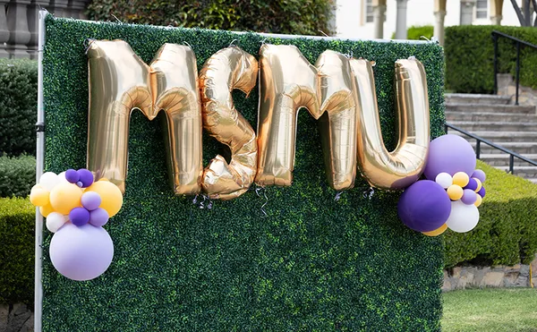 MSMU letter balloons hanging on hedge