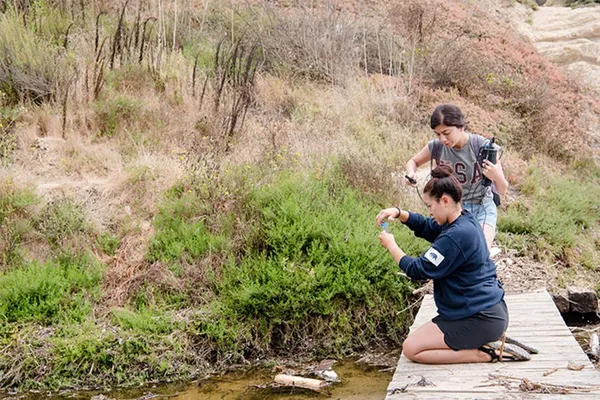 Students taking samples outside