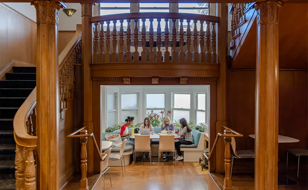 Students Hanging Out Under Stairs