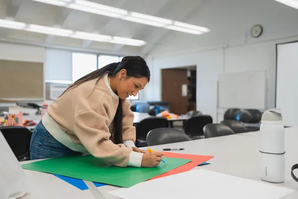 A student working on a felt crafts project