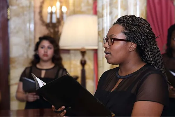 Woman singing in choir