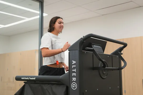 A woman running doing physical therapy