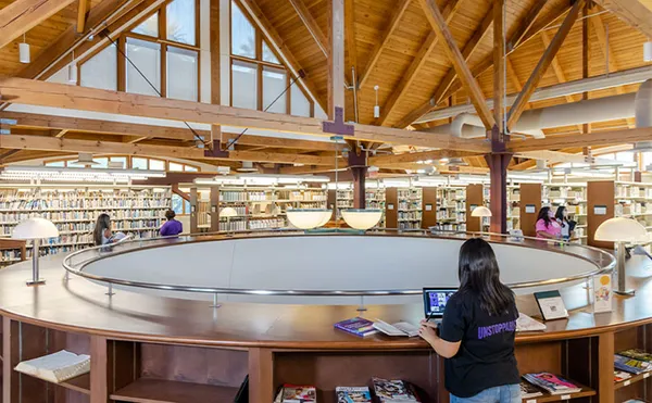 Student on computer in library