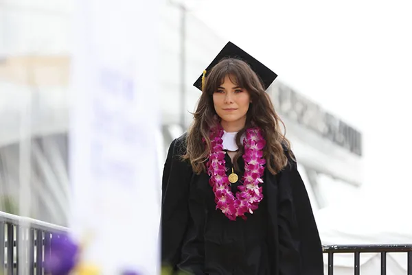 Student walking across stage at graduation