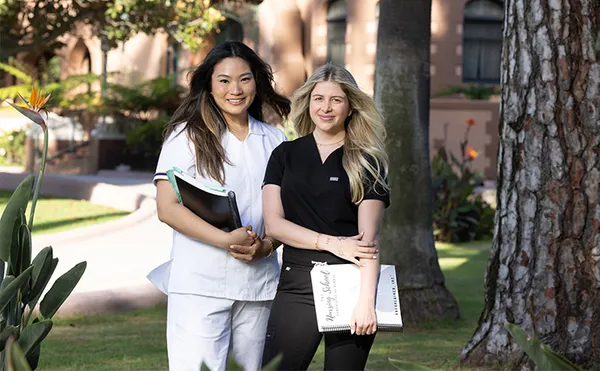 two female nursing students smiling on the doheny campus