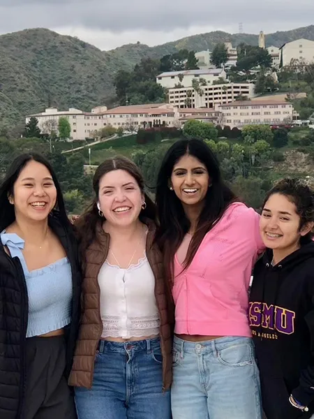A group of students posing with Chalon campus in the background