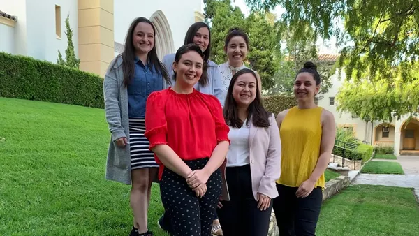 group of research students smiling standing on chalon campus