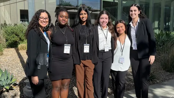 group of students standing together smiling