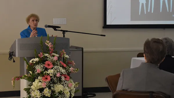 Woman standing on podium