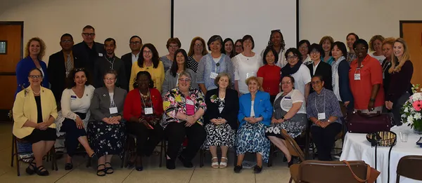 Group of people attending a conference workshop