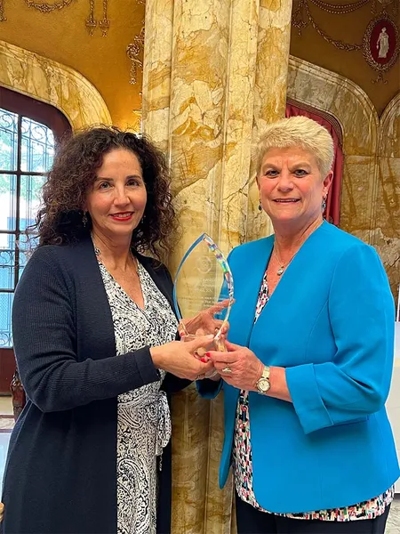 two women smiling at the Roy Adaptation Association conference