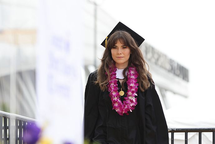 Student walking across stage at graduation