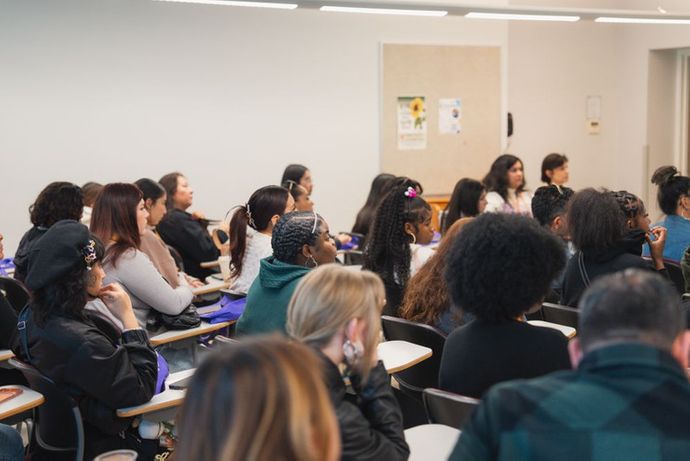 Students sitting in a classroom.