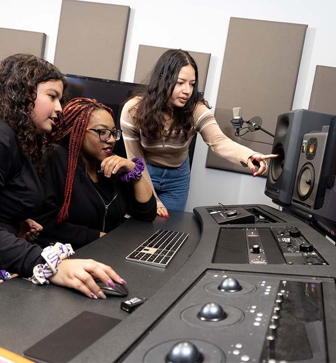 3 students working in the studio together