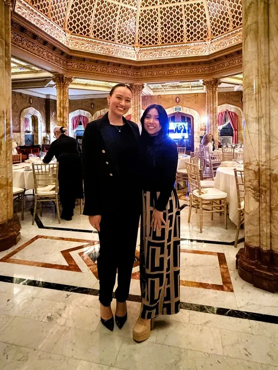 Marielle Shrock '17 (left) and Analiese Yu '15 at the d at the Etiquette and Networking Dinner hosted at the Doheny Mansion last March.