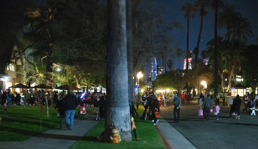 Students and parents walking around campus in halloween costumes