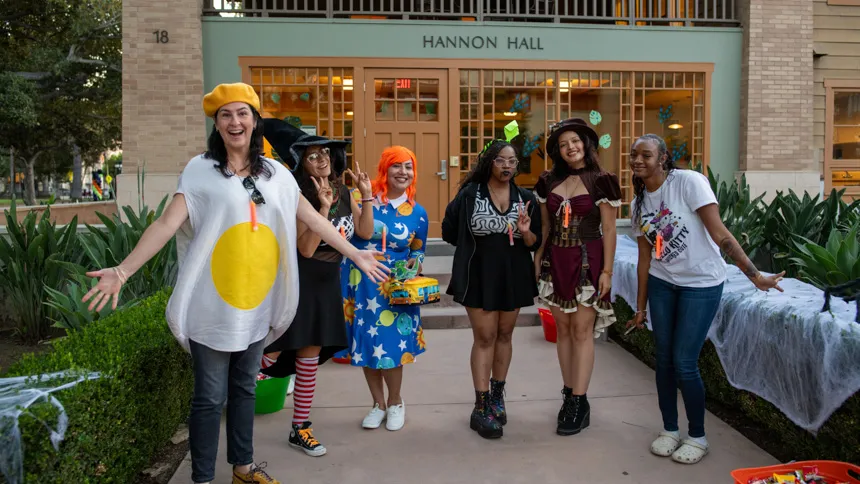 Students and staff posing in costumes
