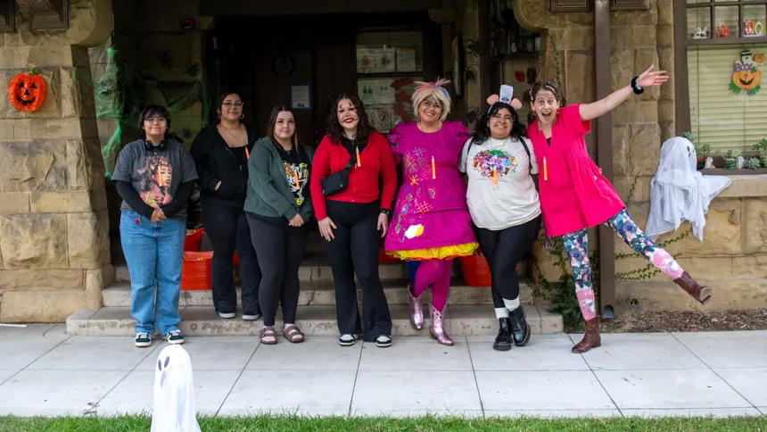 Staff posing in halloween costumes